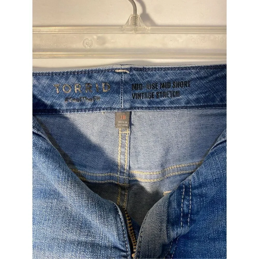 Torrid mid rise, vintage stretch, distressed, raw hem  shorts, 18